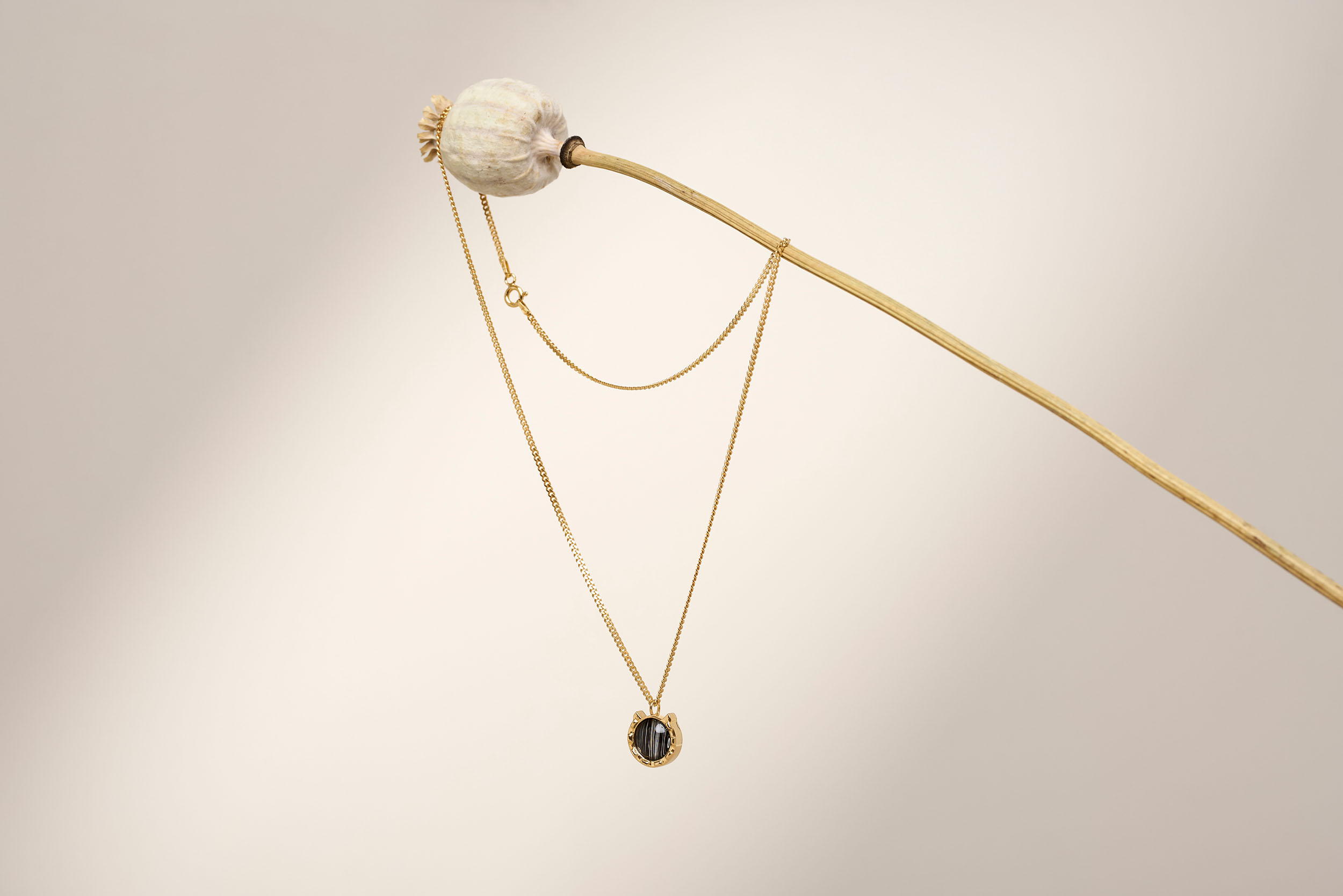 Product photography for Memorabels - jewelry product with elegant presentation and sophisticated styling